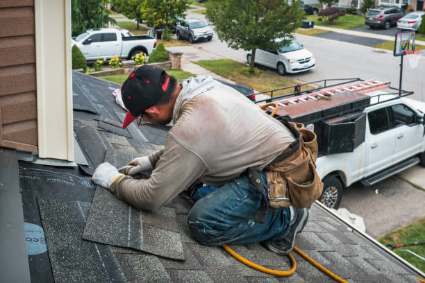 Professional Roofing technician working in West Warren, MA